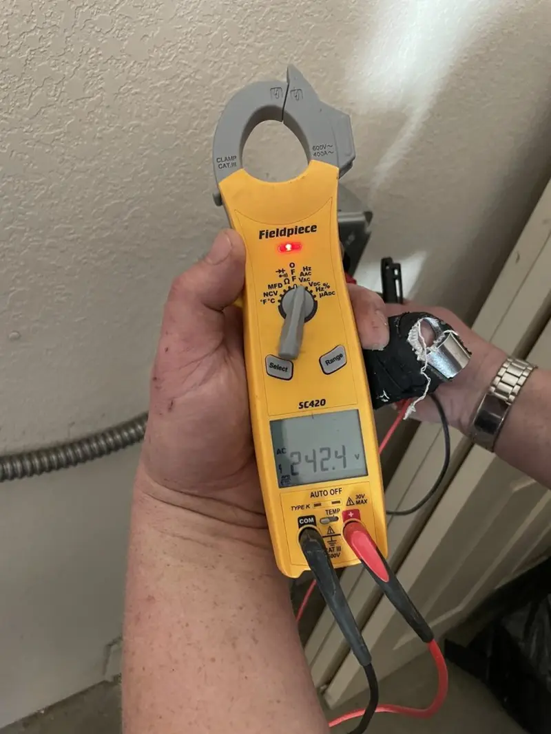 Voltage testing with clamp meter during Ceiling Fan Installation in Green Hill